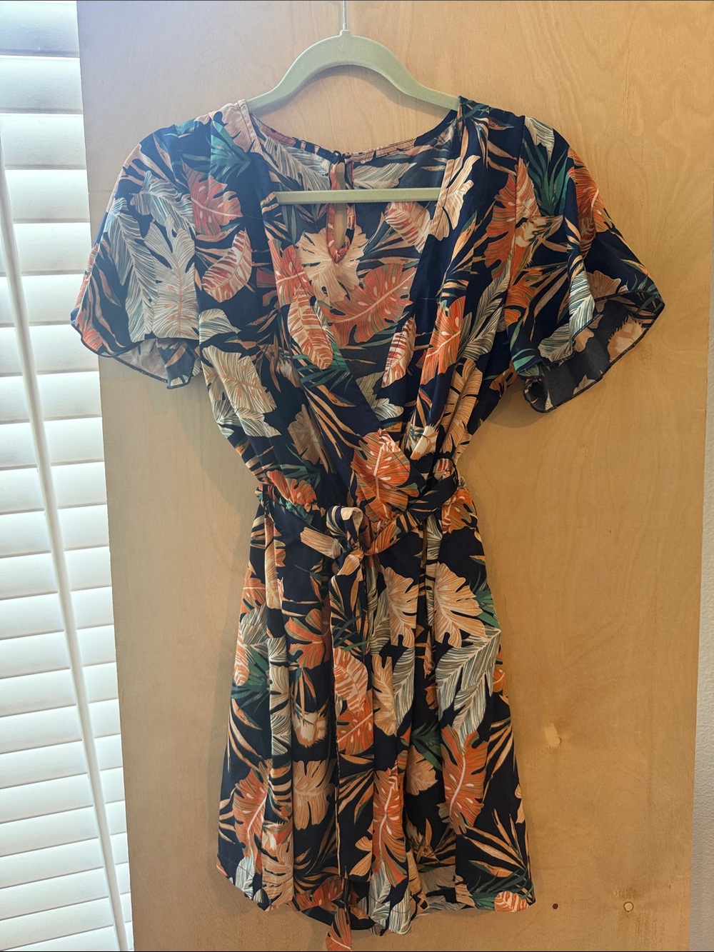NavyTropical Print Wrap romper with Orange and Green Leaves